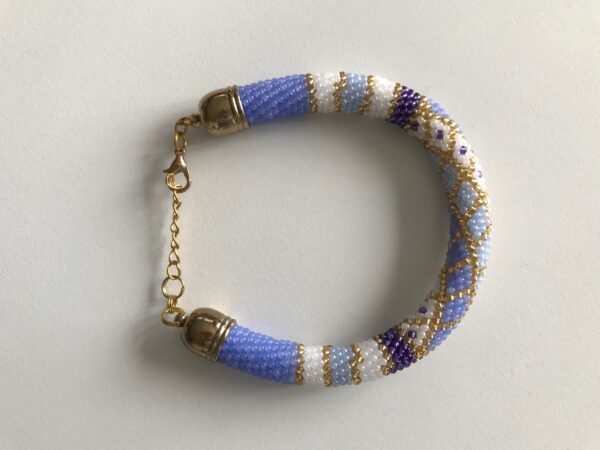Armband violett weiss gold Perlen